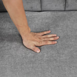 Canapé convertible U_STYLE en tissu doux avec coussins, idéal pour deux personnes, conçu par eprolo, en position de fauteuil ou de lit