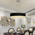 Lustre moderne en cristal eprolo avec branches élégantes, suspendu avec plusieurs cristaux brillants et un design contemporain.