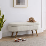 Banquette ottomane ovale beige avec rangement, pieds en bois de caoutchouc, meuble de rangement élégant et pratique.