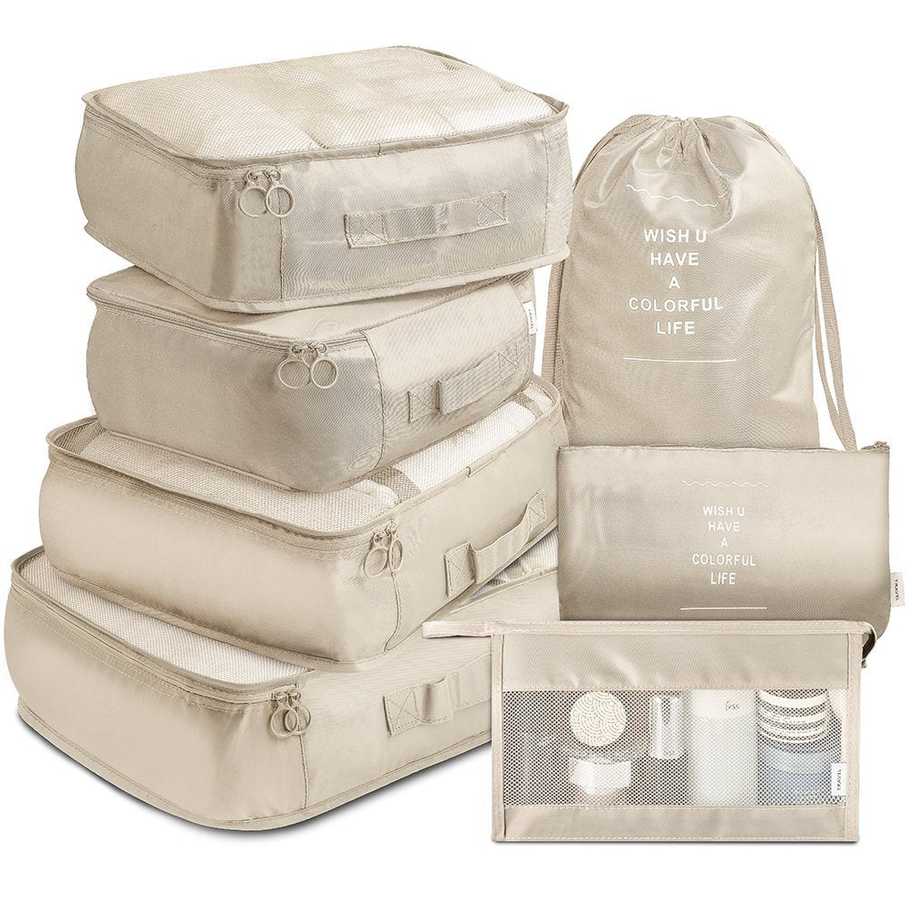 Ensemble de 7 sacs de rangement de voyage eprolo pour vêtements, organisé dans une valise sur un fond blanc.