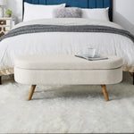 Banc coffre ovale beige avec pieds en bois de caoutchouc, dimensions 43,5"x16"x16", design pratique pour rangement et décoration.