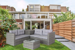 Ensemble de mobilier d'extérieur en rotin gris avec 4 pièces, canapé sectionnel avec coffre de rangement, style moderne et confortable.