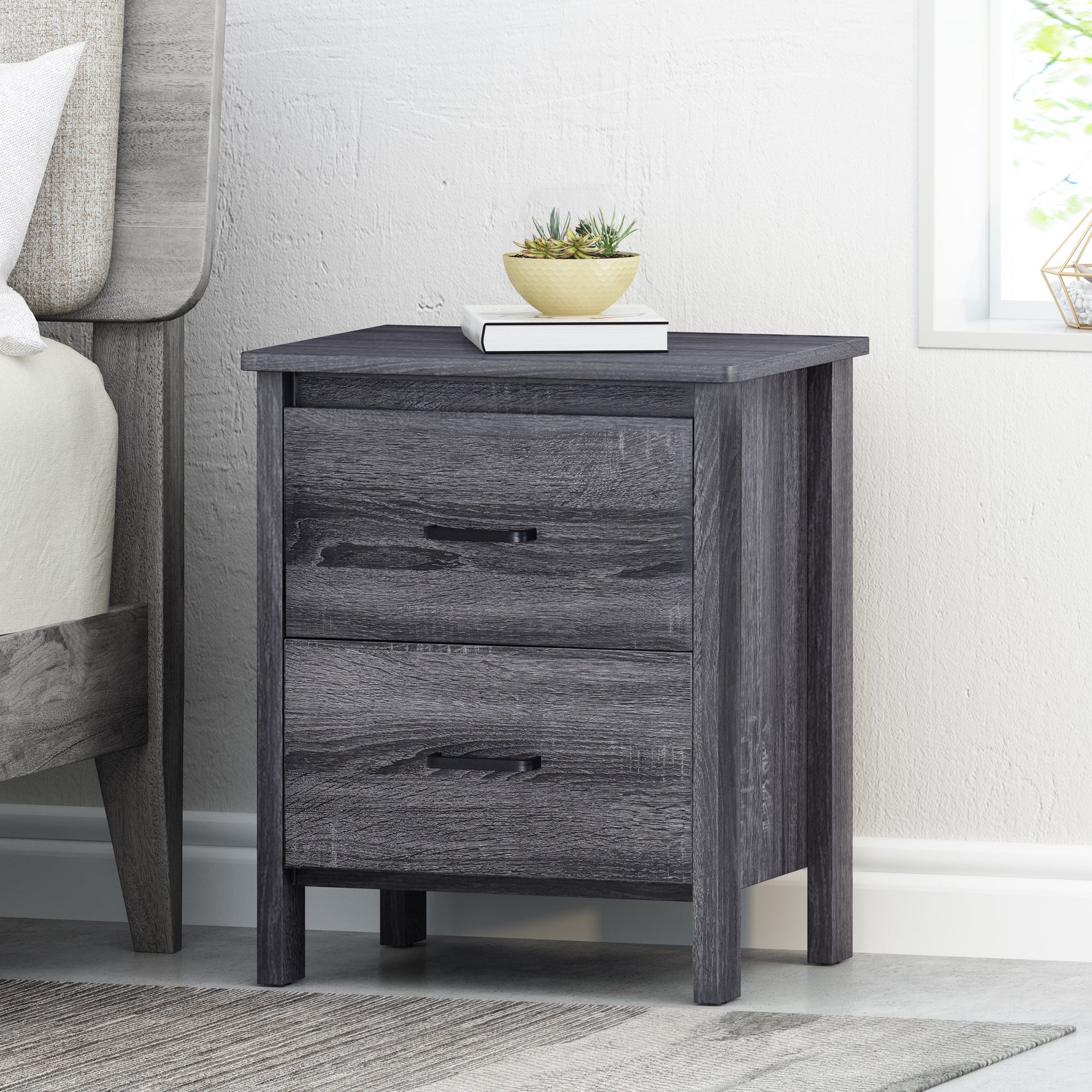 Nuitée eprolo, table de chevet moderne avec tiroirs en bois clair, design épuré et finition lisse visible sur l'image.