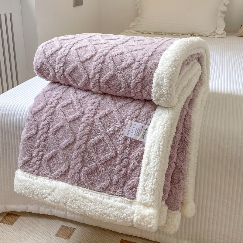 Couverture double couche en polar eprolo pour l'automne et l'hiver, douce et chaude, visible en image.