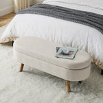 Banquette coffre ovale beige avec pieds en bois de caoutchouc, dimensions 43,5"x16"x16", meuble de rangement élégant et pratique.