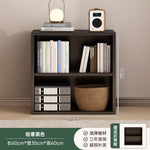 Bibliothèque eprolo noire avec structure en grille pour rangement au sol, idéale pour chambre ou espace de vie.