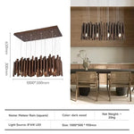 Lustre en bois de style ferme pour restaurant, design rustique, avec branches en bois et bougeoirs, de la marque Novah.