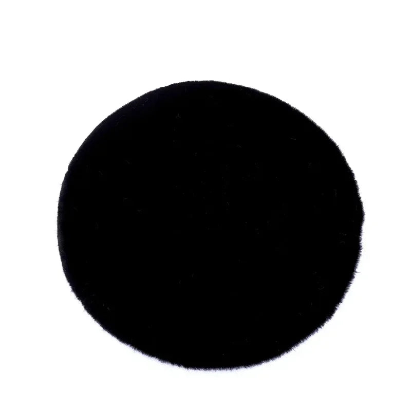 Tapis rond coloré en peluche moderne de la marque Novah, parfait pour salon, chambre ou salle d'enfants.