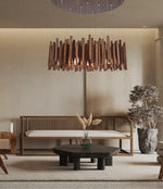 Lustre en bois de style ferme pour restaurant, design rustique, avec branches en bois et bougeoirs, par Novah.