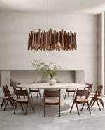Lustre en bois de style ferme pour restaurant, design rustique avec plusieurs branches et bougeoirs, de la marque Novah