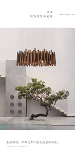 Lustre en bois de style ferme pour restaurant, chandelier rustique Novah avec branches en bois naturel et ambiance chaleureuse.