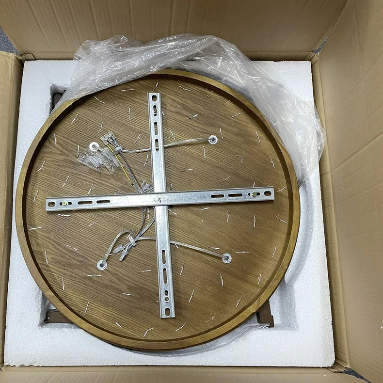 Lustre en bois pour restaurant farmhouse Novah avec plusieurs branches et bougies pour une ambiance chaleureuse.