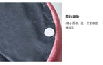 Pouf Ottoman moderne en tissu de la marque Novah, meuble de décoration élégante pour salon ou chambre, vue de face.