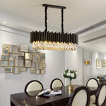 Éclairage moderne simple en cristal noir pour salon, lampe suspendue élégante de la marque Novah, avec design minimaliste et sophistiqué.